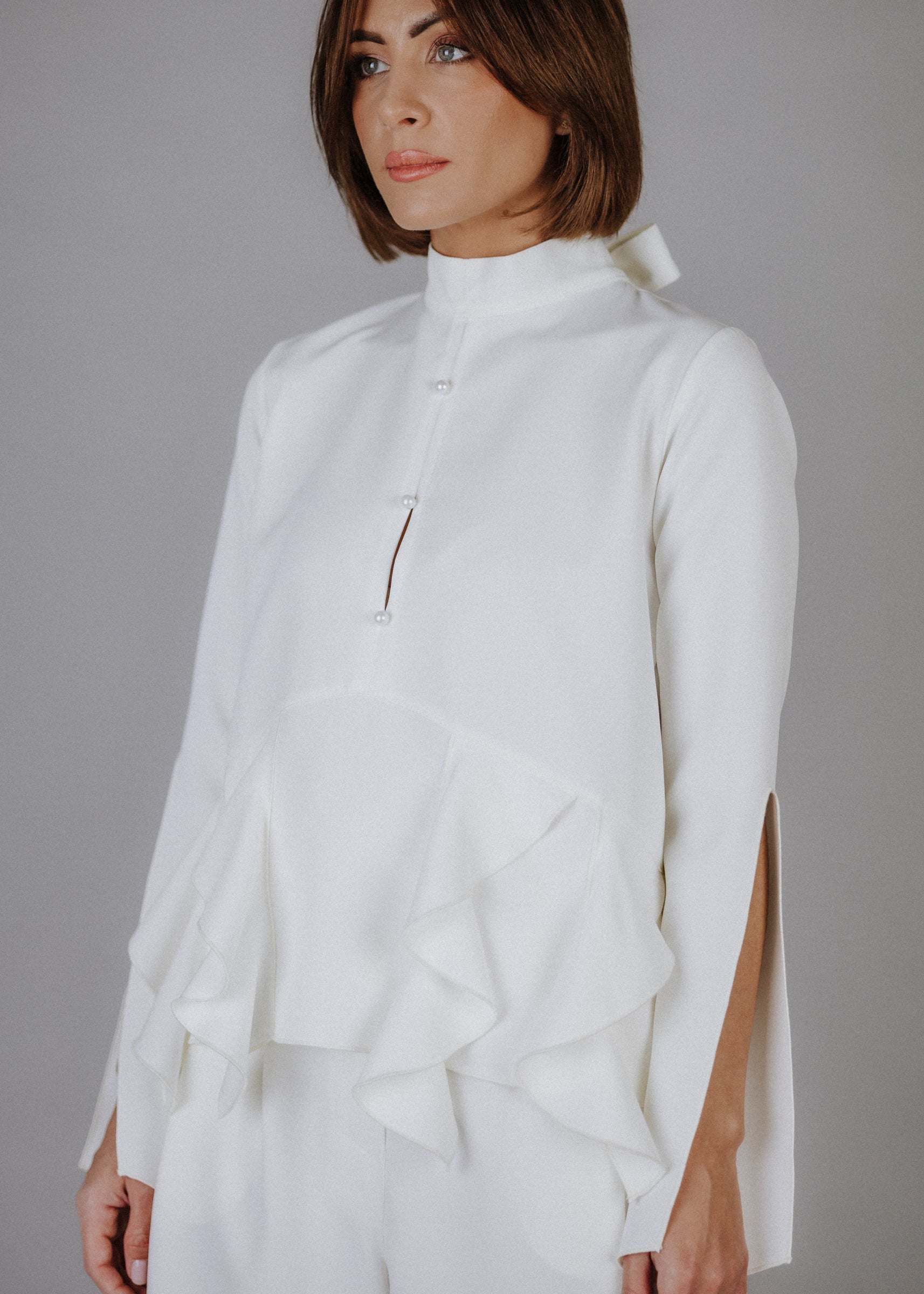 Curly frilly top in ecru
