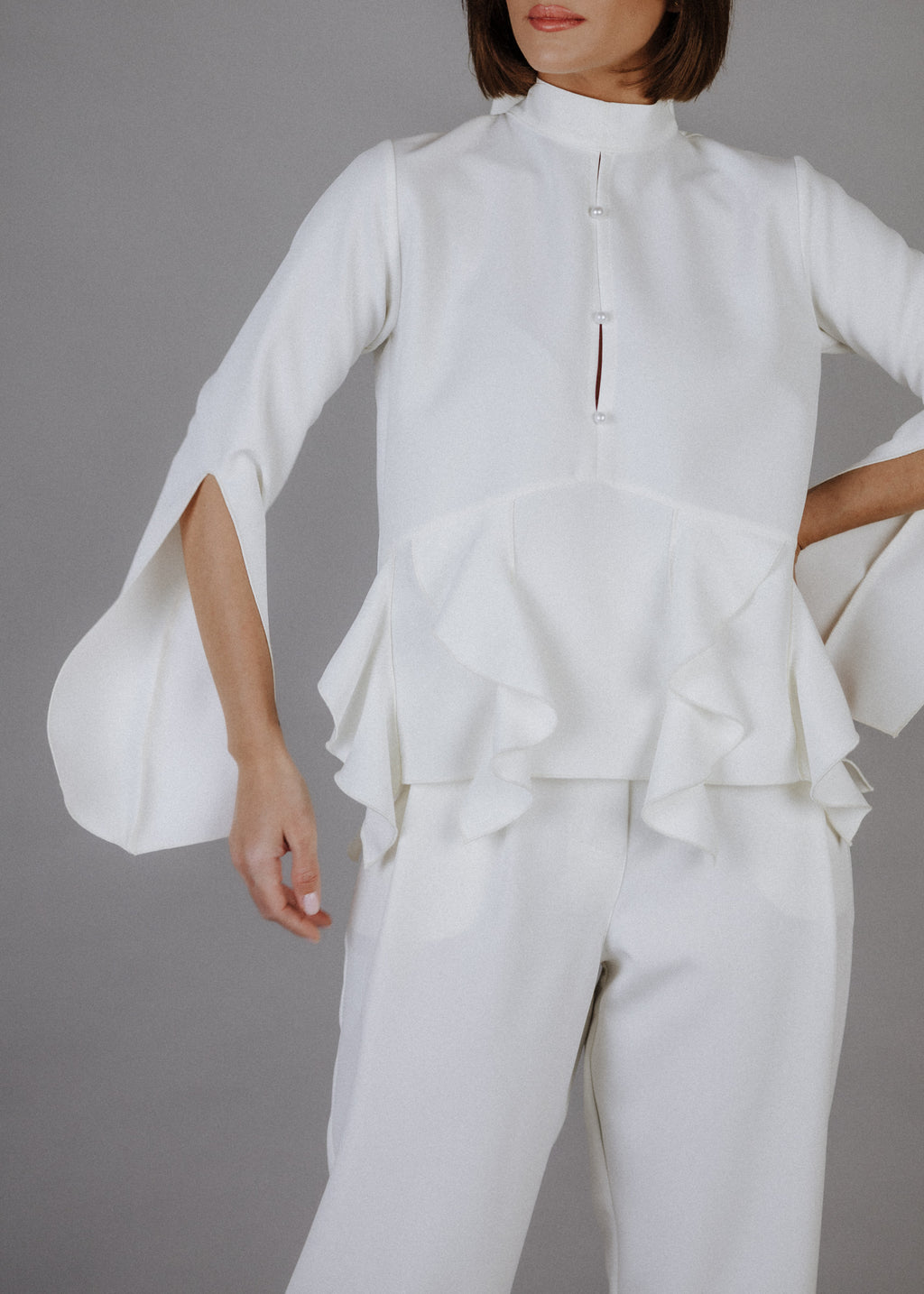Curly frilly top in ecru