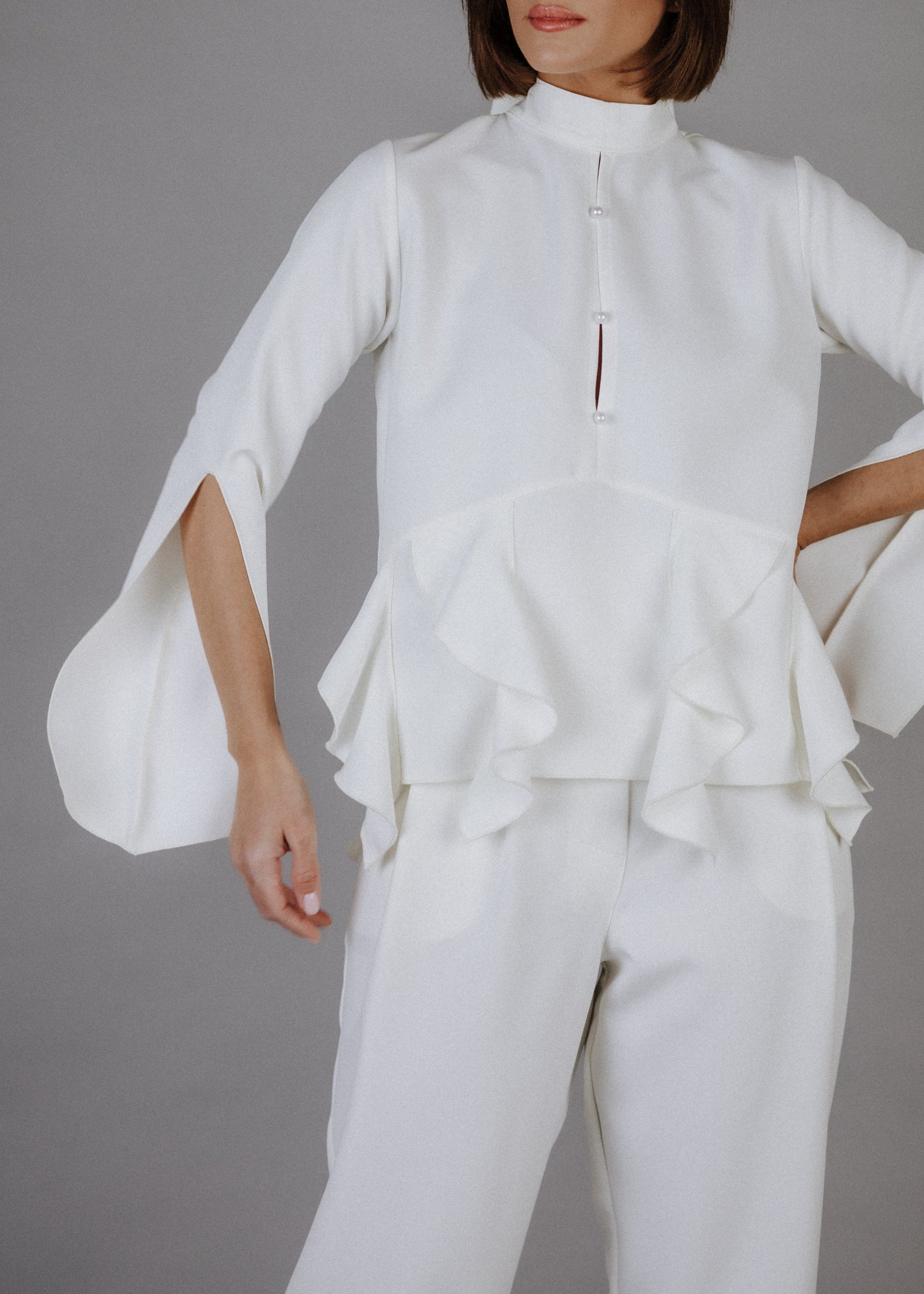 Curly frilly top in ecru