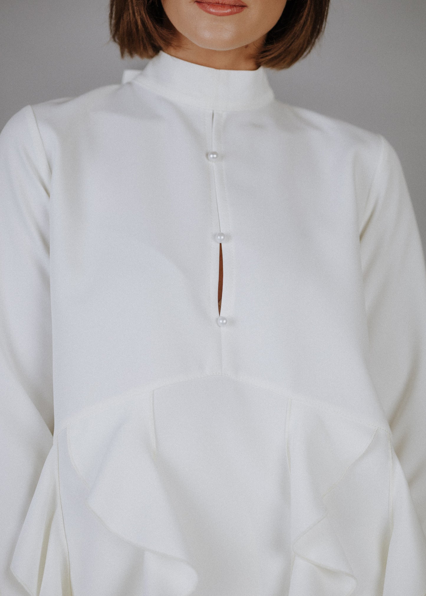 Curly frilly top in ecru