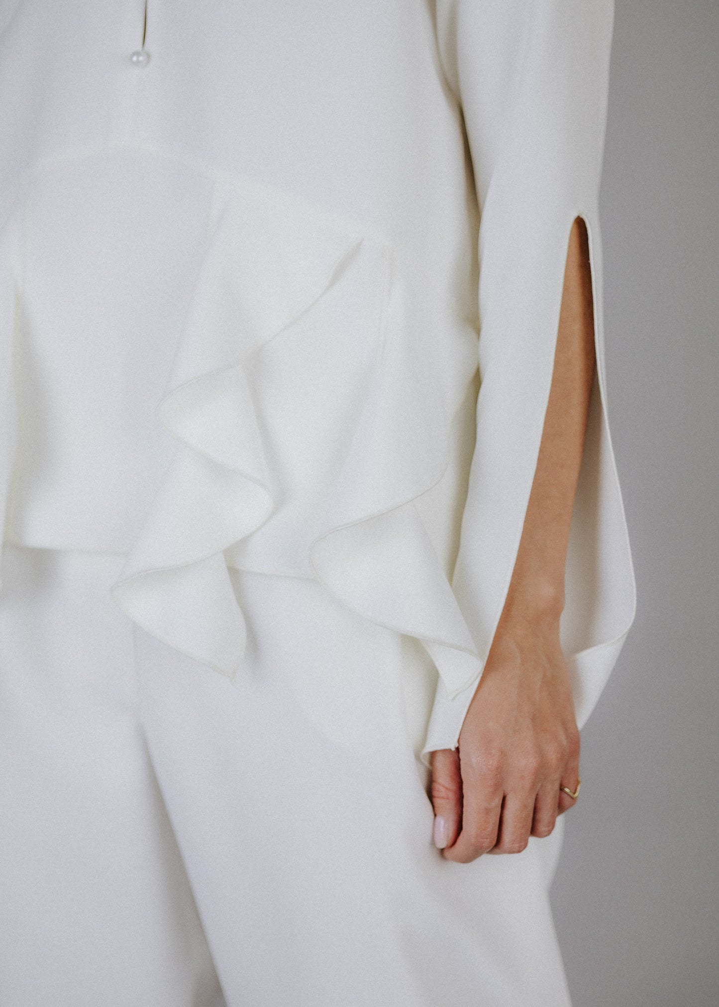 Curly frilly top in ecru