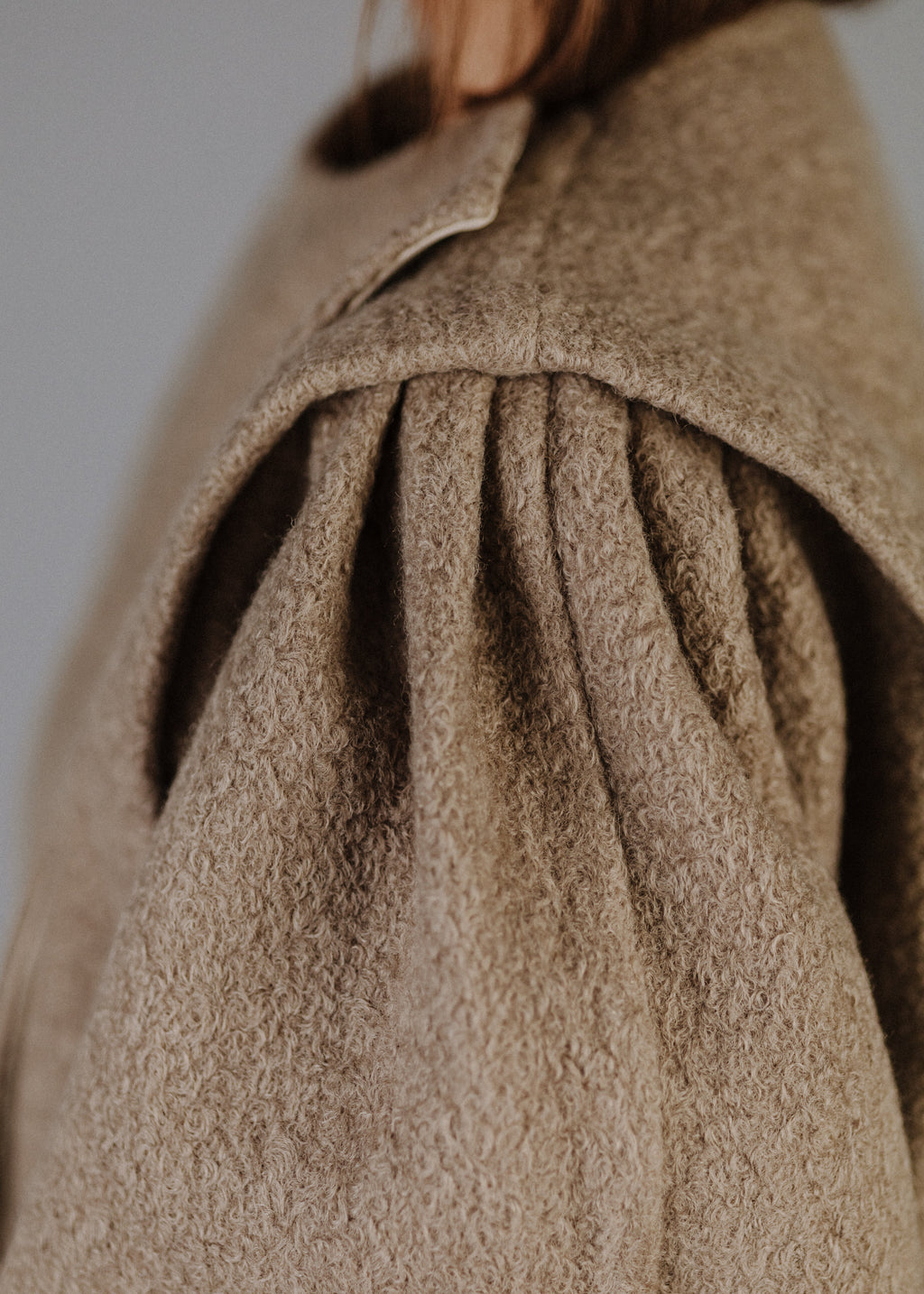 BOUCLÉ PEPLUM TOP IN TAUPE