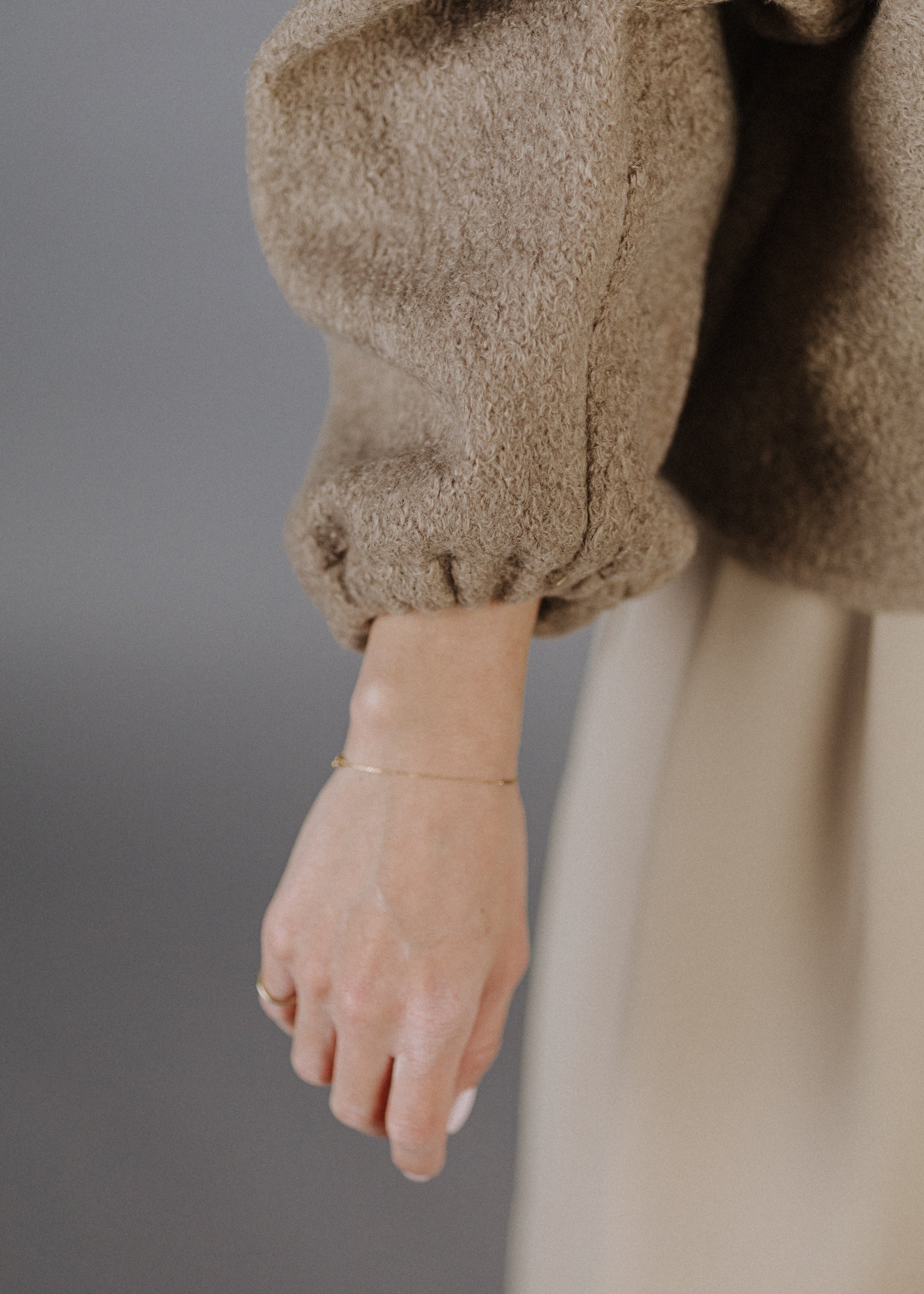 BOUCLÉ PEPLUM TOP IN TAUPE
