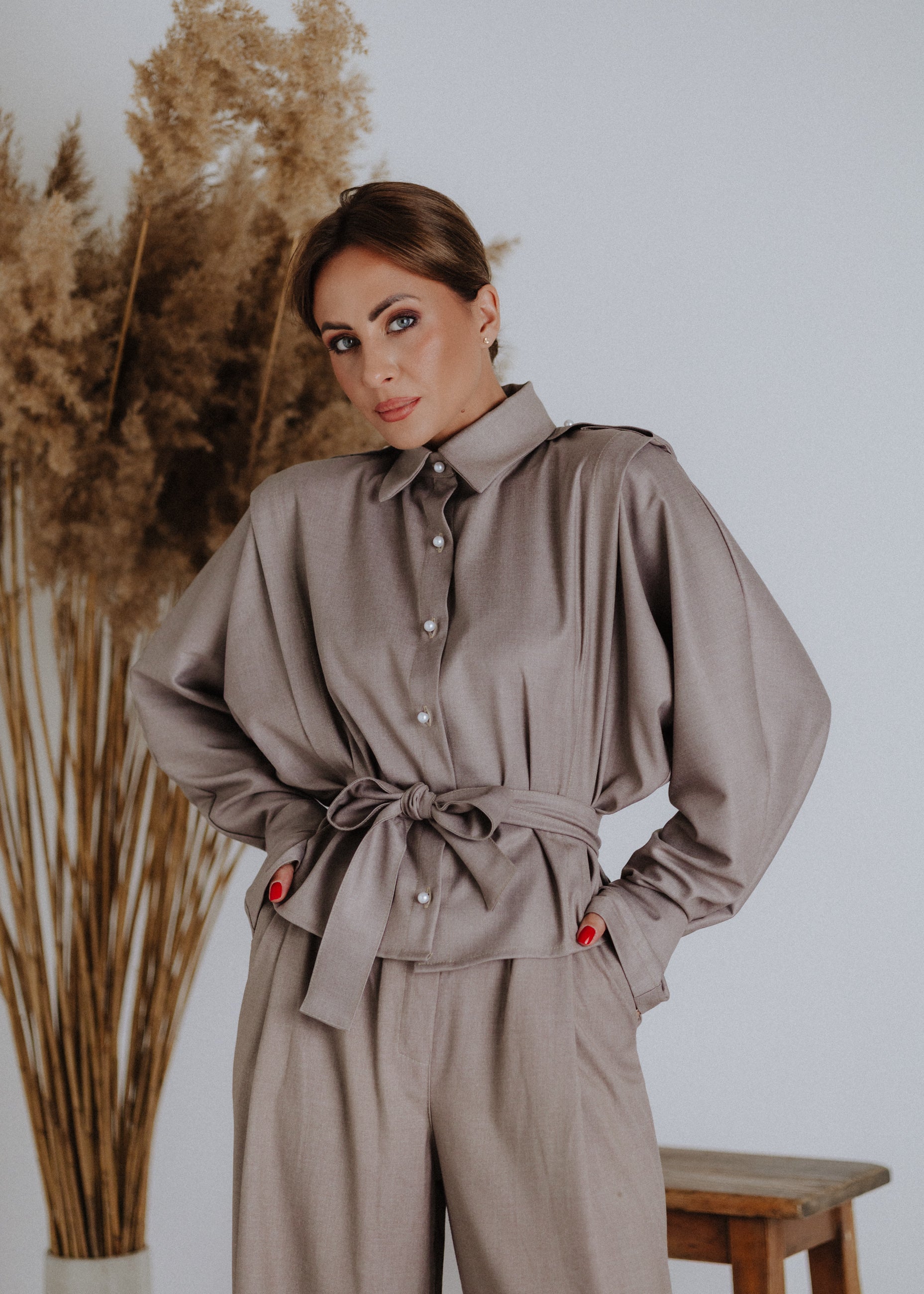 Taupe blouse with decorative straps
