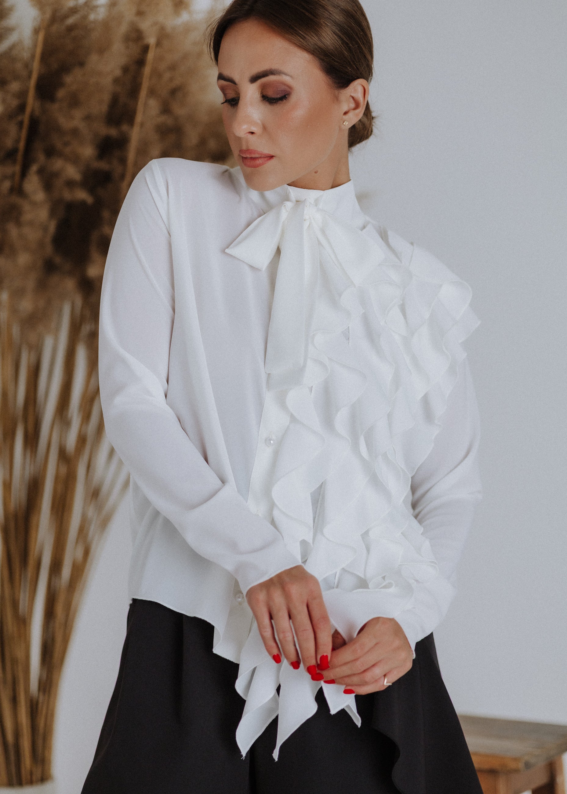 Curly ruffled blouse in ecru