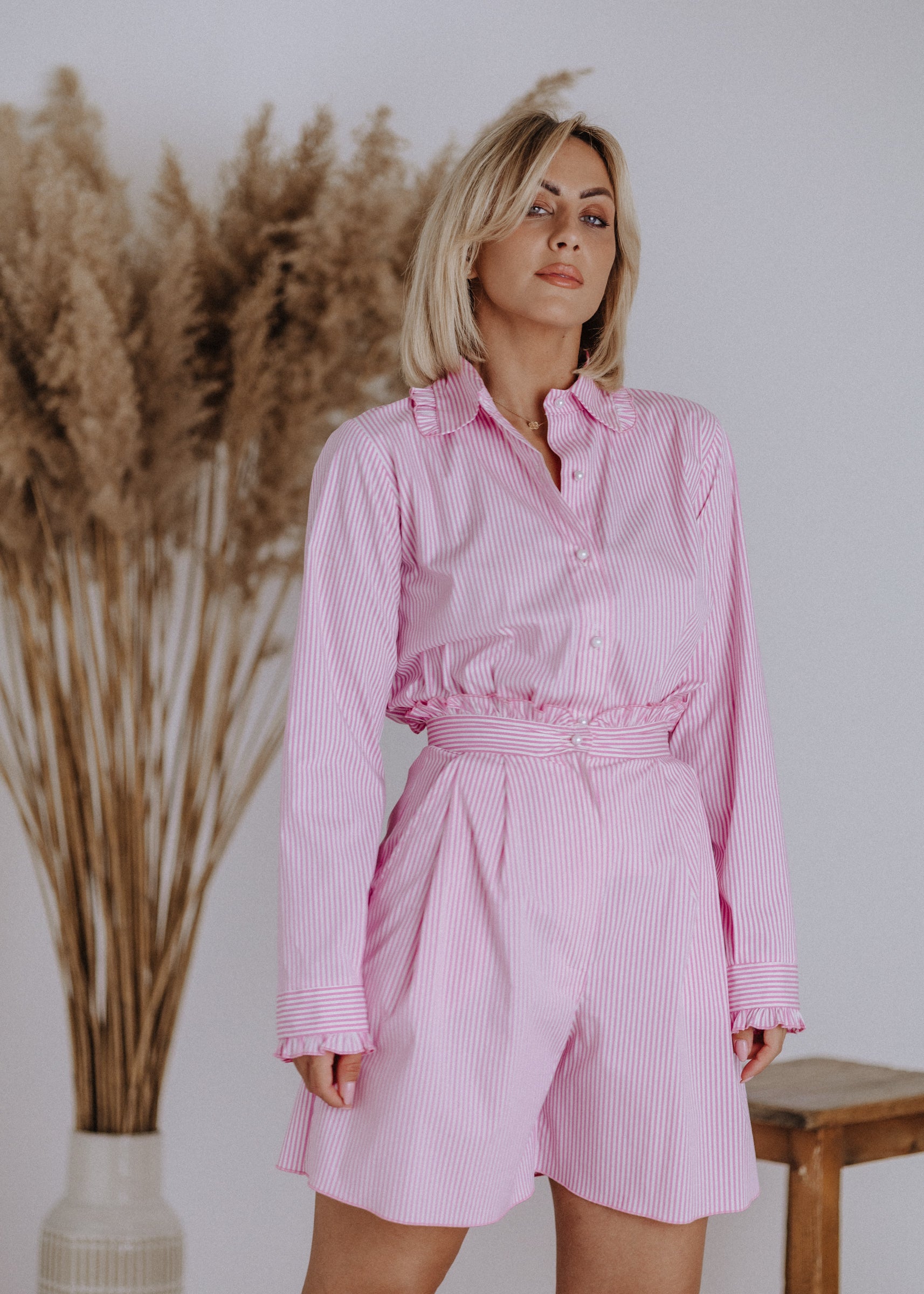 Striped shirt with ruffles in pink
