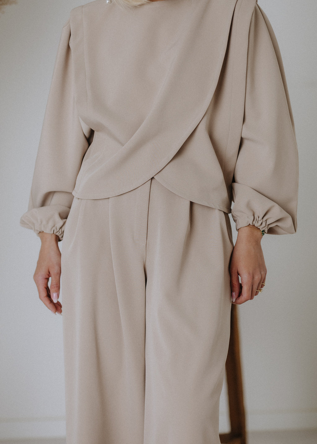 Overlapping beaded top in taupe