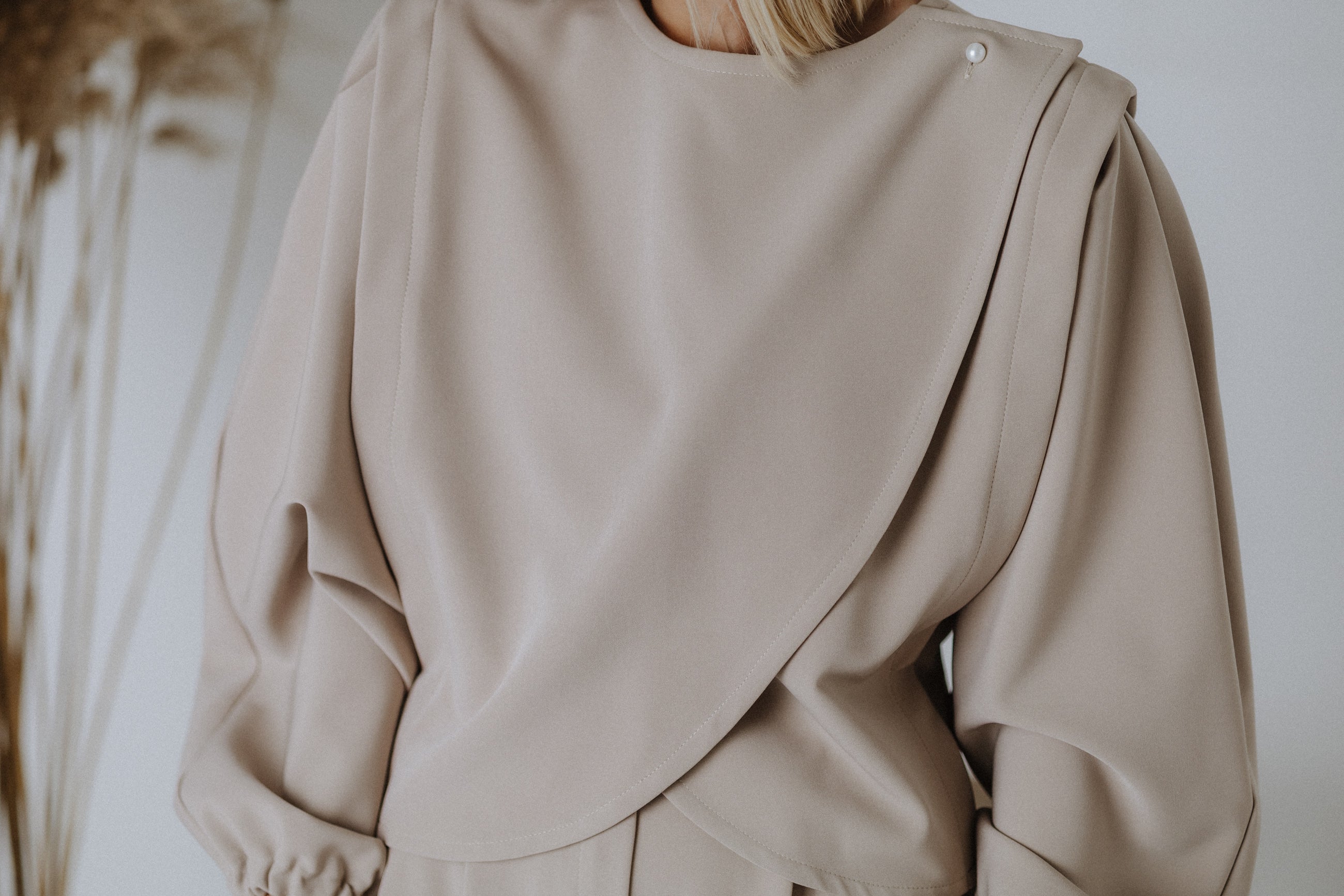 Overlapping beaded top in taupe