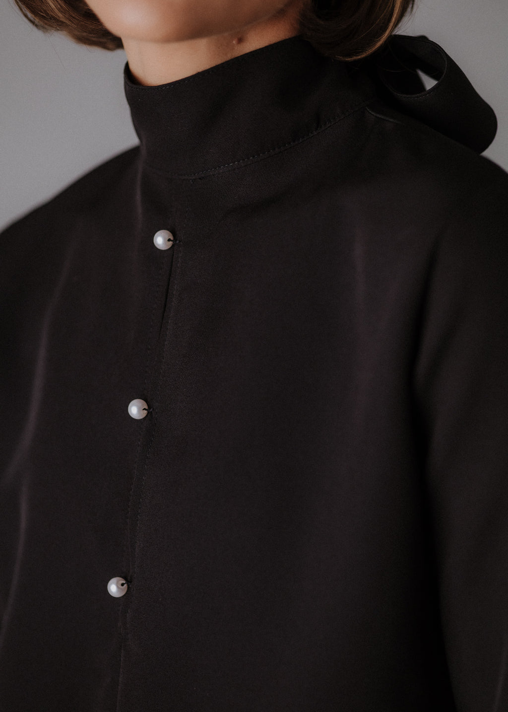 Fine fabric with top curls in black