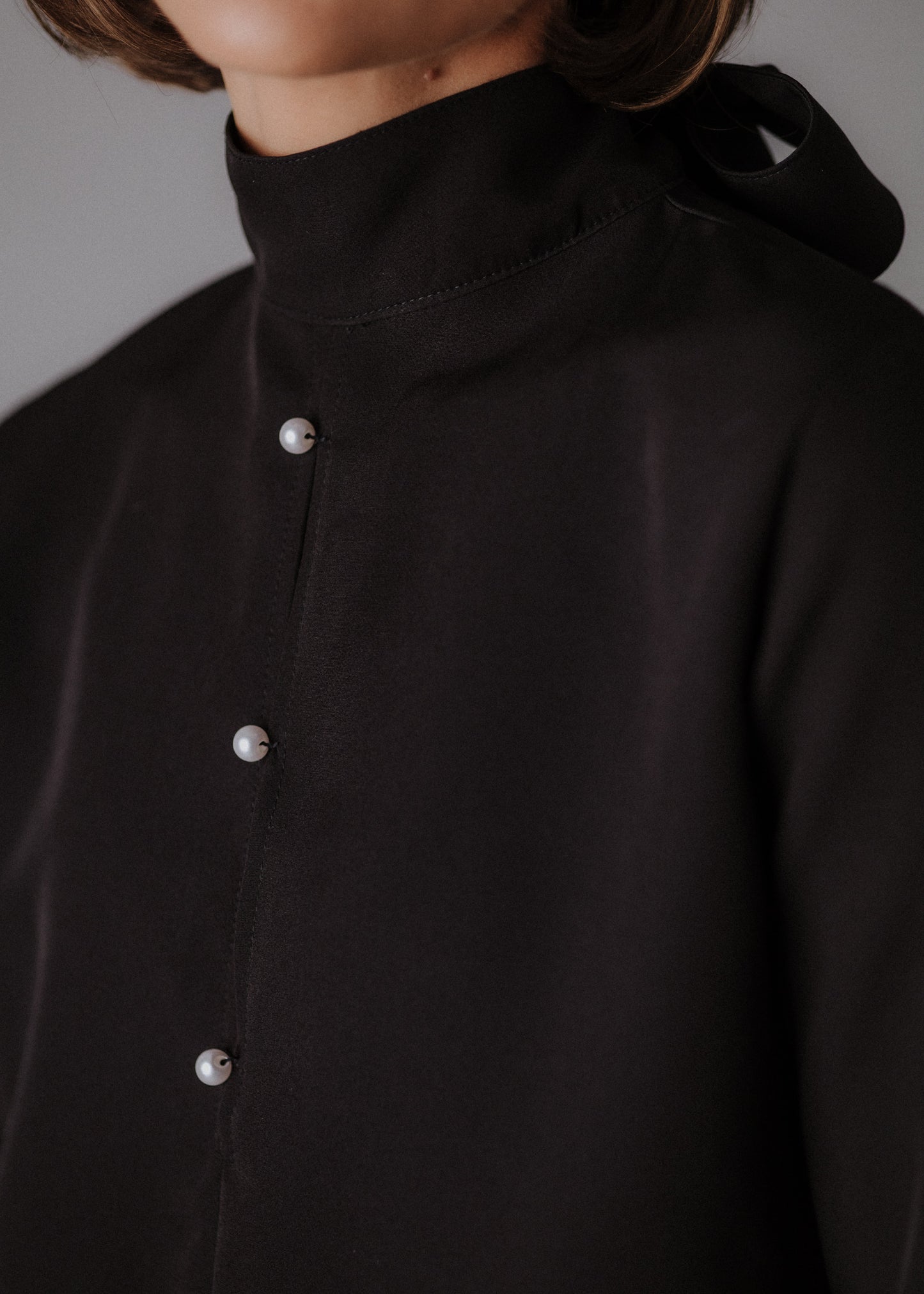 Fine fabric with top curls in black