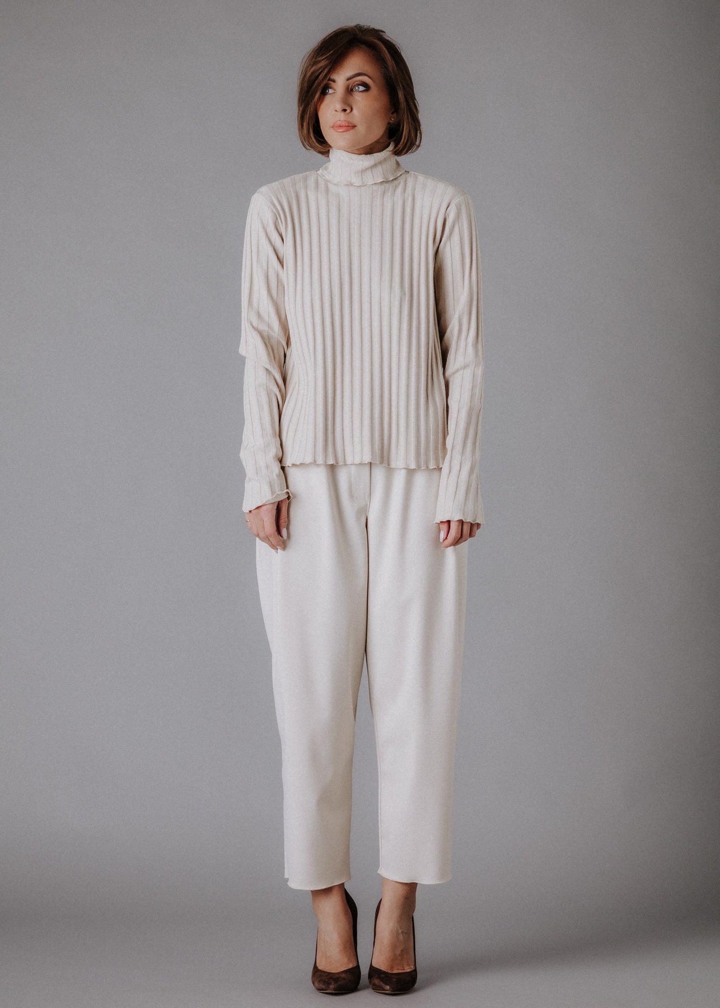 Turtleneck knitted fabric in pastel nude color