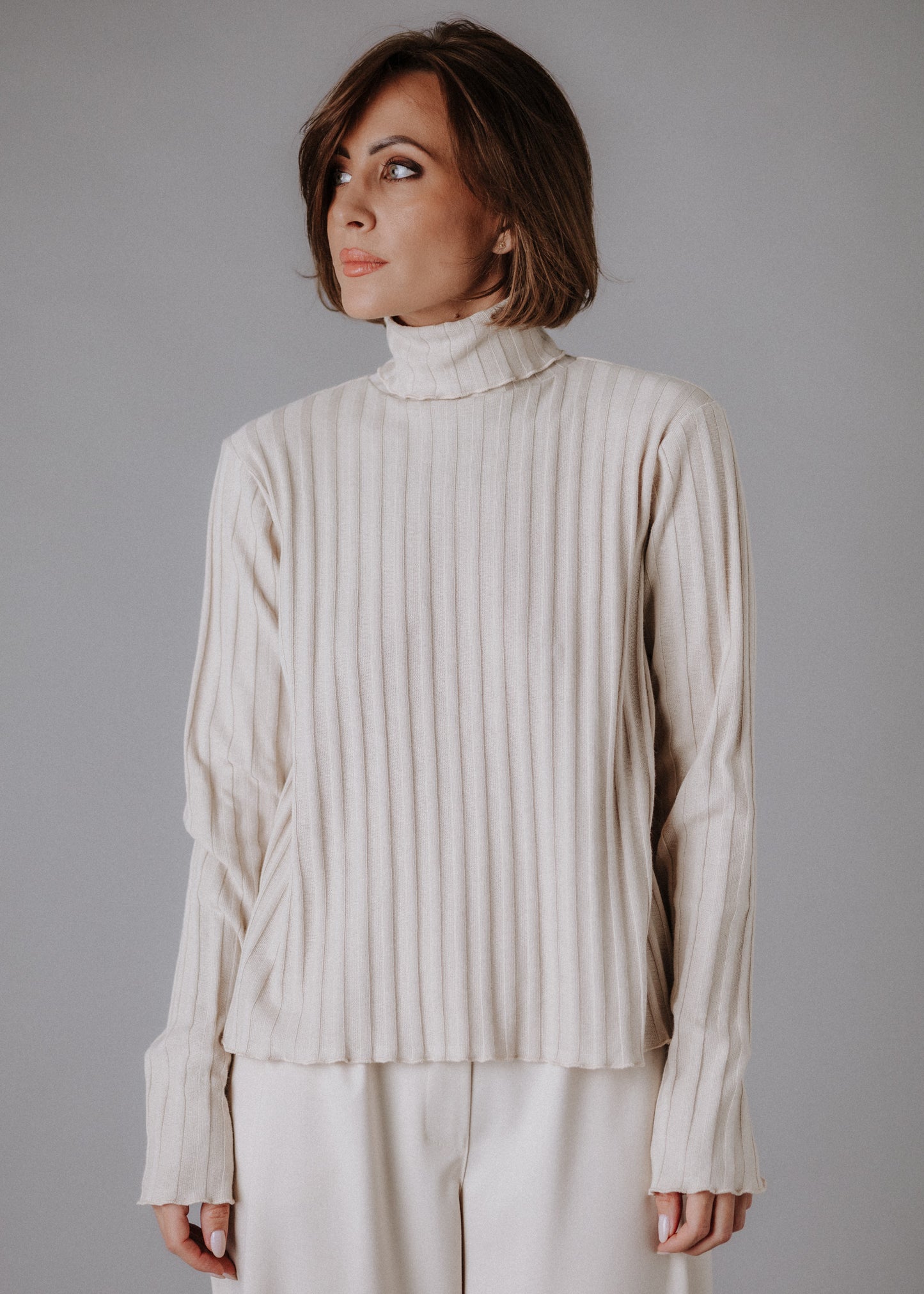 Turtleneck knitted fabric in pastel nude color