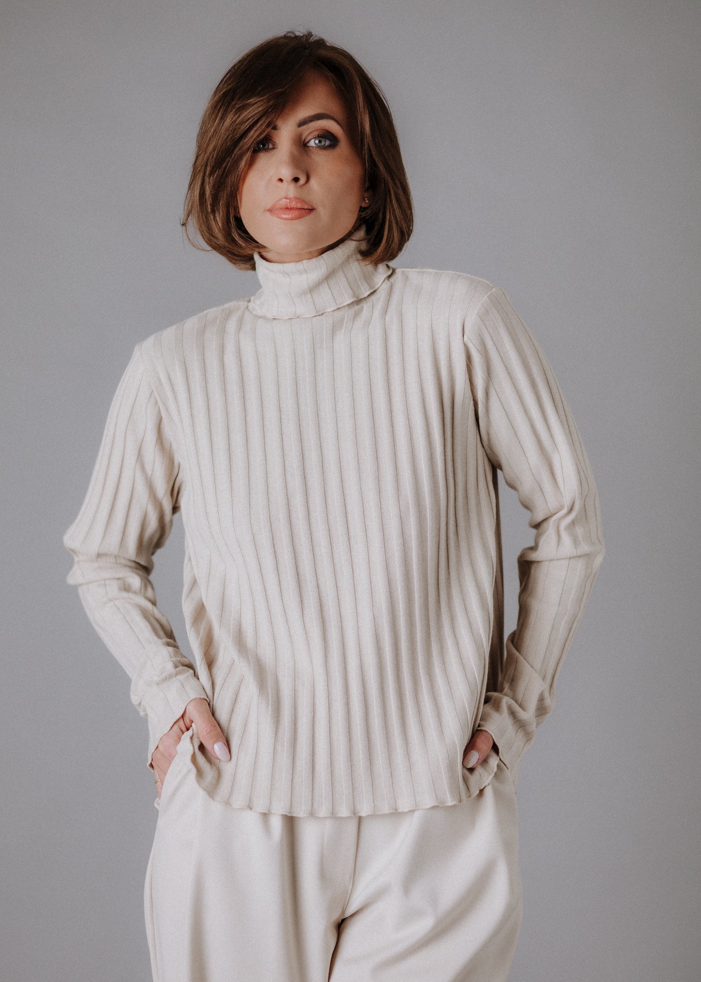 Turtleneck knitted fabric in pastel nude color