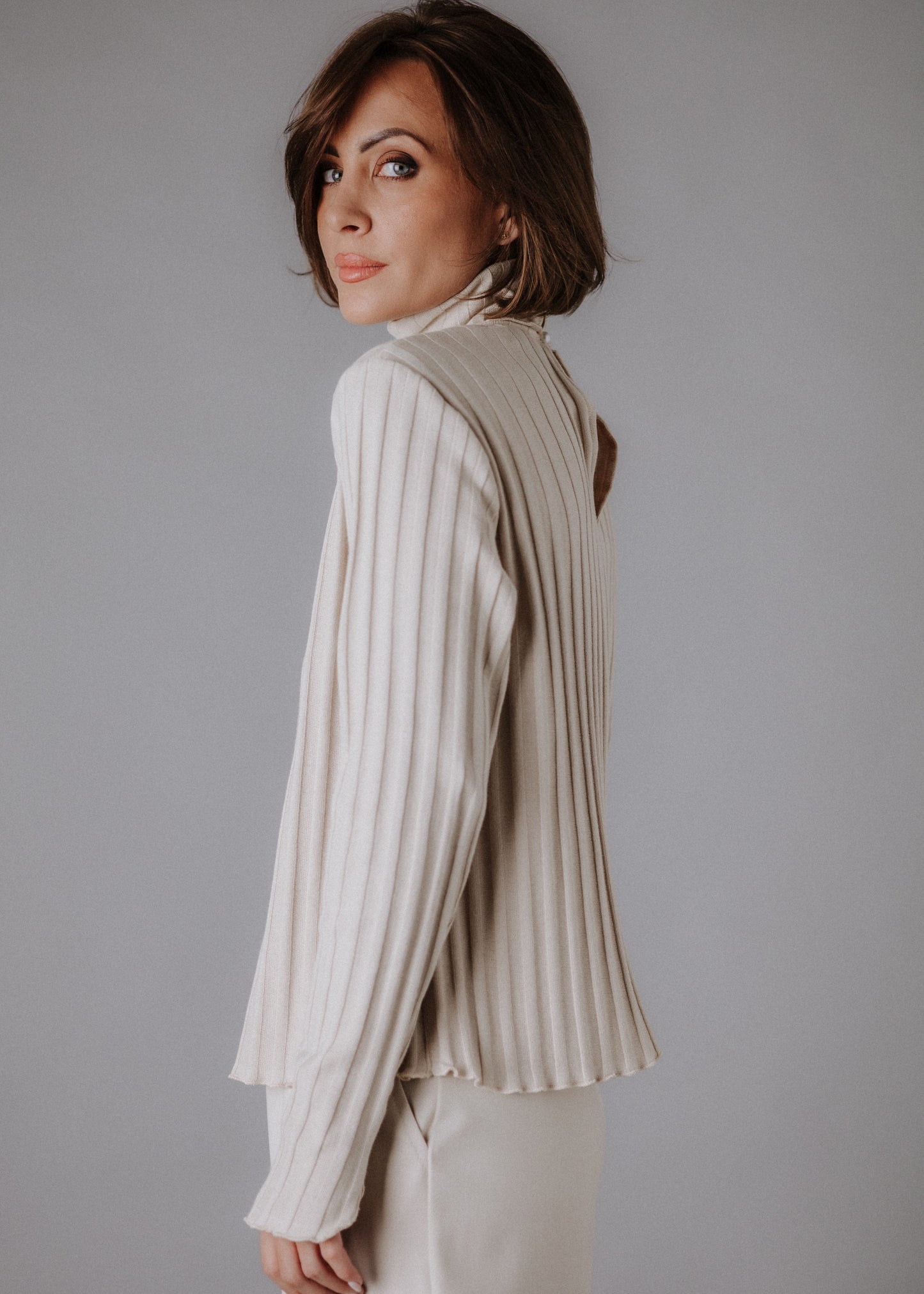 Turtleneck knitted fabric in pastel nude color