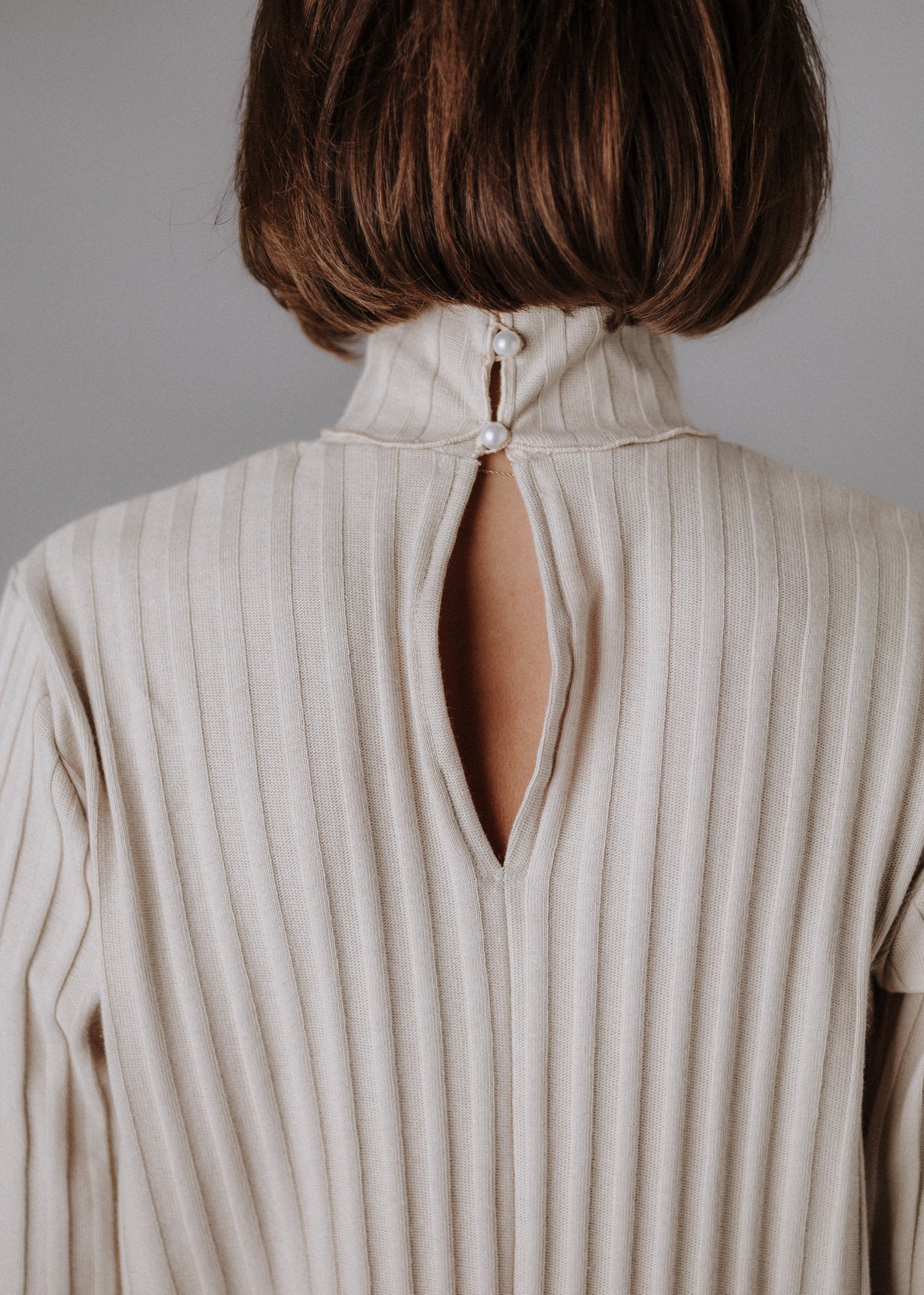 Turtleneck knitted fabric in pastel nude color